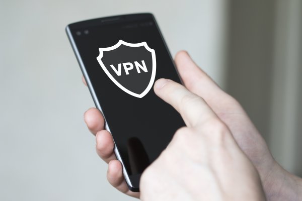 turbo vpn overview vpn services hand holding smartphone vpn on touchscreen